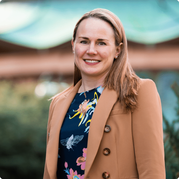 Carter Kidd, President of Campaign Solutions smiles outdoors in Alexandria.
