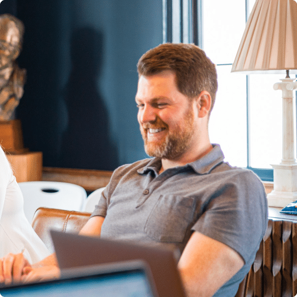 Vice President of Client Services, Jared Smith reacts cheerfully during a leadership meeting at the Push Digital home office in Charleston, South Carolina.