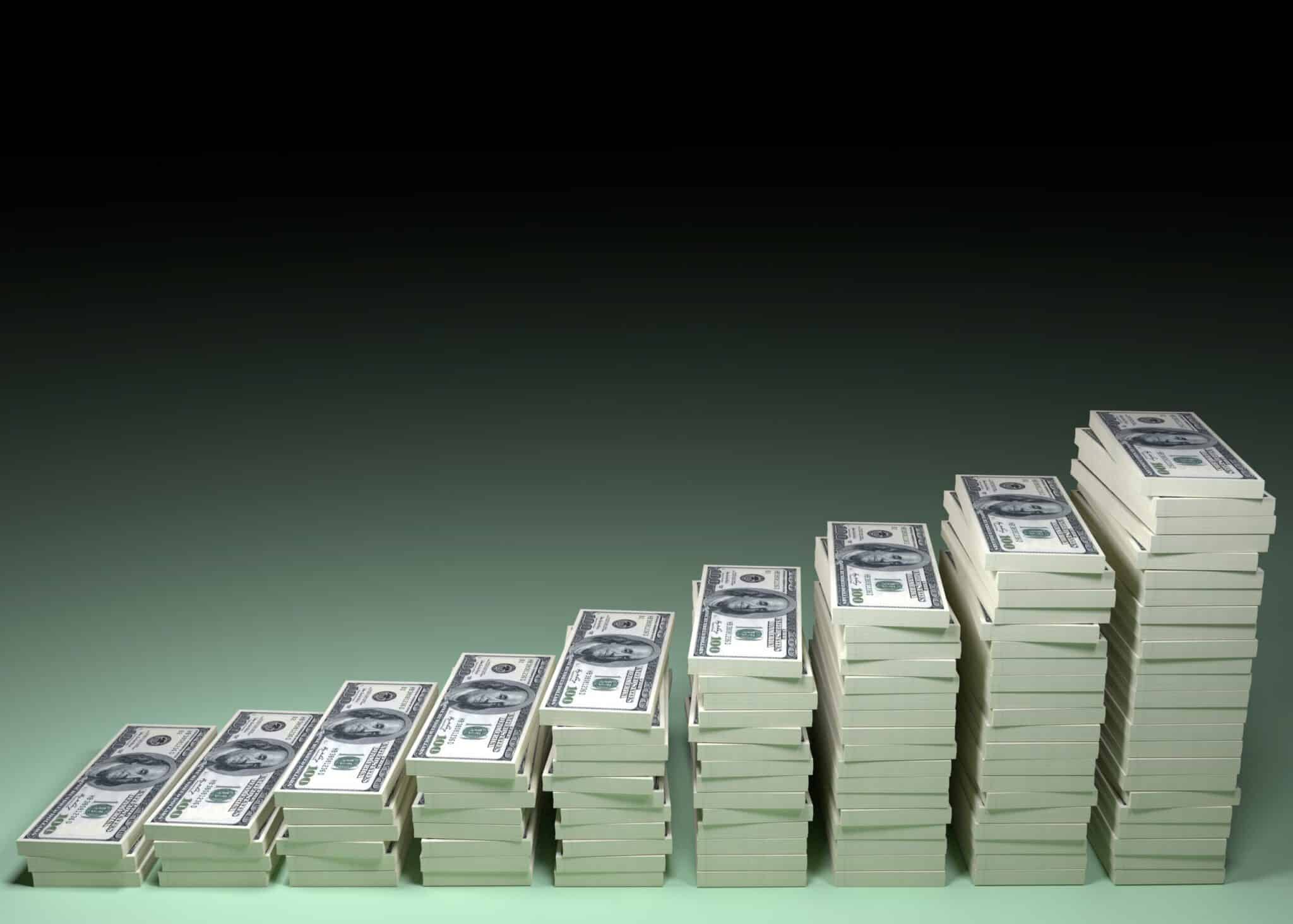 A photo of stacked hundred dollar bills, increasing in amount to portray fundraising donations for GOP.